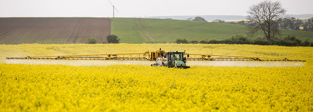 Tractor spraying a field. Photo by Chafer Machinery / CC BY 2.0